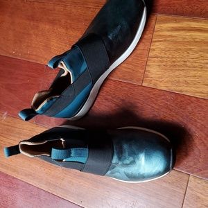 Bionic slip on metallic teal shoe